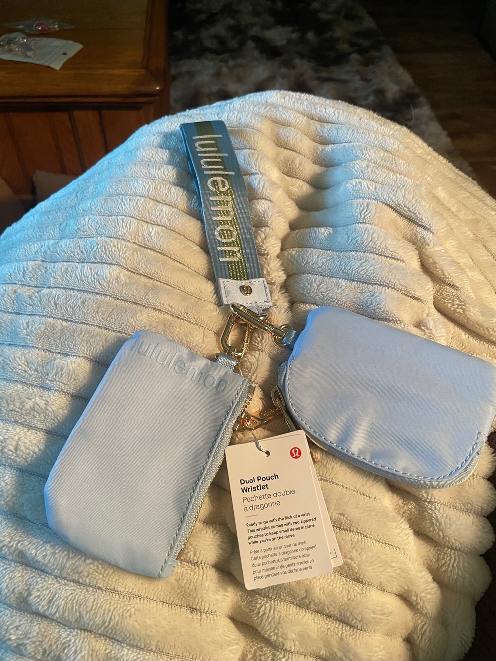 Lululemon Dual Pouch Wristlet in Light Blue with gold monogram and gold hardware